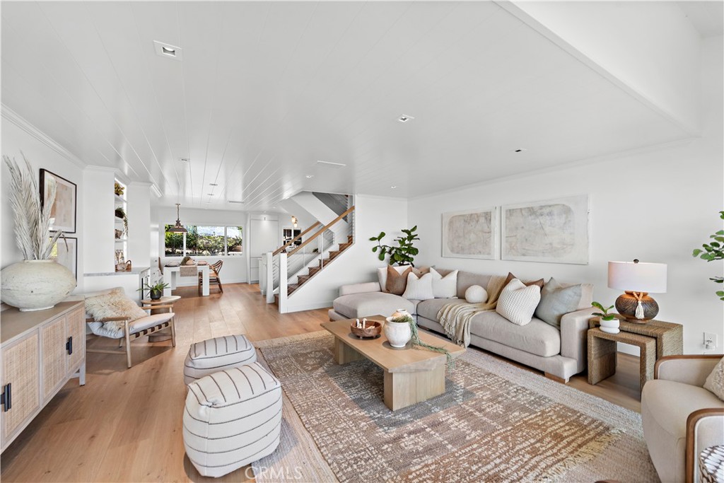 25 Blue Lagoon Laguna Beach, CA 92651 - Photo 7 of 53 a living room with furniture and wooden floor