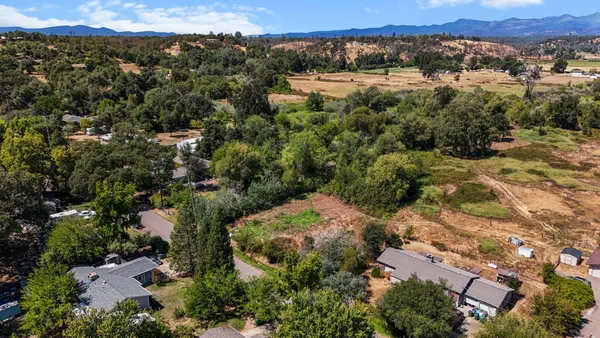 an aerial view of residential house with outdoor space