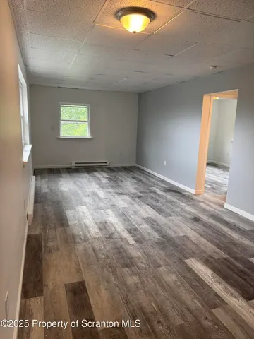 a view of an empty room and window