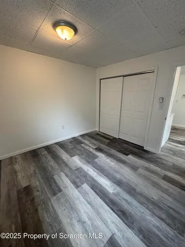 wooden floor in a hall with an entryway