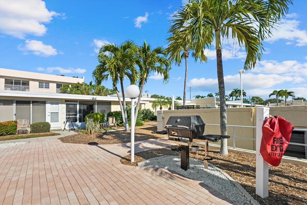 6006 Midnight Pass Road, Unit 11 Sarasota, FL 34242 - Photo 22 of 45 a view of a house with outdoor seating space