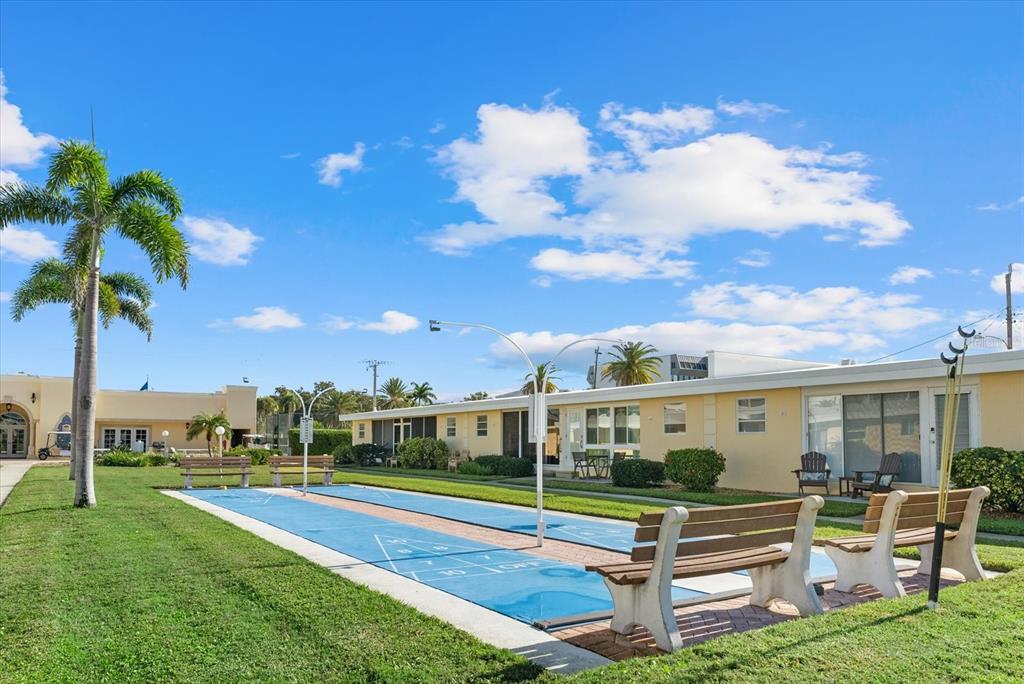 6006 Midnight Pass Road, Unit 11 Sarasota, FL 34242 - Photo 23 of 45 a view of an house with backyard space and pool