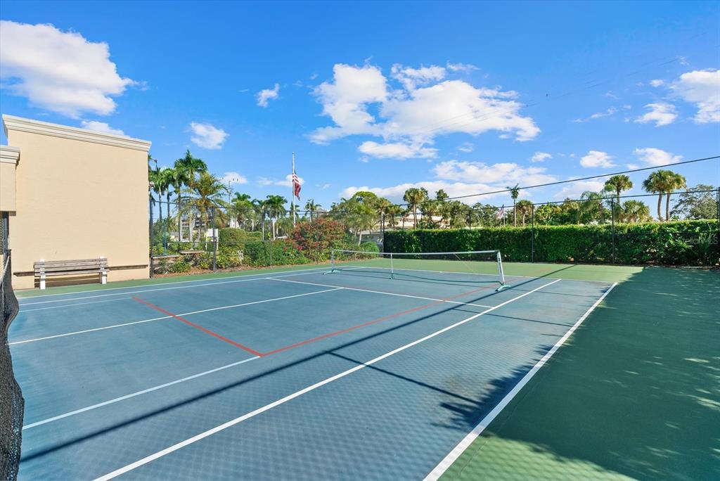 6006 Midnight Pass Road, Unit 11 Sarasota, FL 34242 - Photo 27 of 45 a view of a tennis court