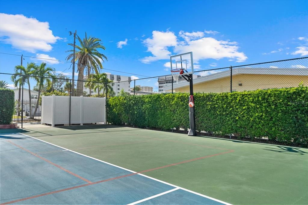 6006 Midnight Pass Road, Unit 11 Sarasota, FL 34242 - Photo 28 of 45 a view of a tennis court