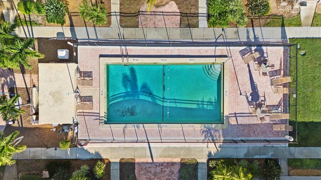 6006 Midnight Pass Road, Unit 11 Sarasota, FL 34242 - Photo 30 of 45 a front view of a house with a garden