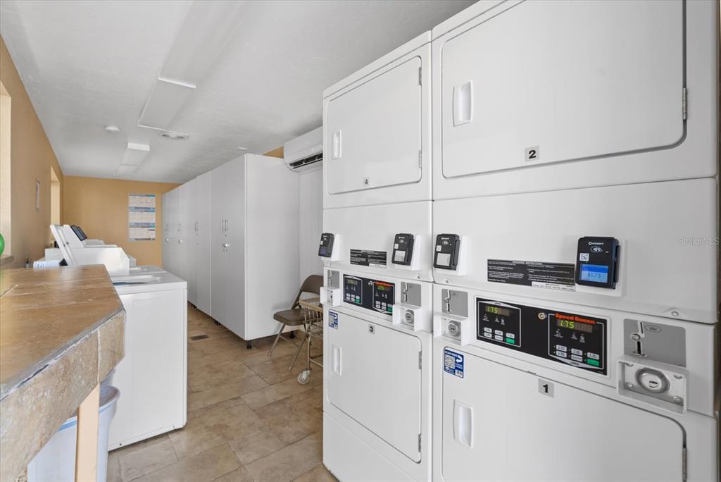 6006 Midnight Pass Road, Unit 11 Sarasota, FL 34242 - Photo 33 of 45 a view of kitchen with sink and refrigerator
