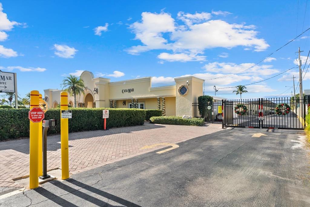 6006 Midnight Pass Road, Unit 11 Sarasota, FL 34242 - Photo 35 of 45 a view of a parking space with sign board