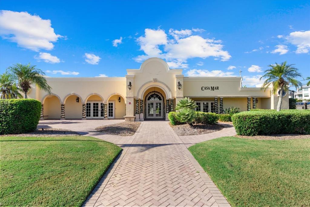 6006 Midnight Pass Road, Unit 11 Sarasota, FL 34242 - Photo 41 of 45 a front view of a house with garden