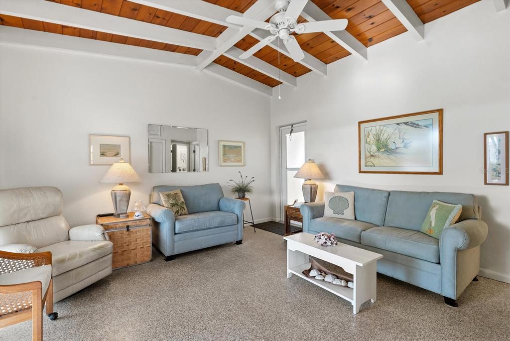 6006 Midnight Pass Road, Unit 11 Sarasota, FL 34242 - Photo 7 of 45 a living room with furniture