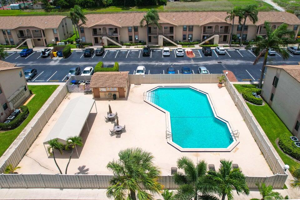9480 Boca Cove Circle, Unit 415 Boca Raton, FL 33428 - Photo 12 of 16 pool aerial