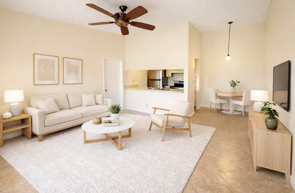 a living room with furniture and a flat screen tv