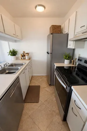 a kitchen that has a sink and a stove