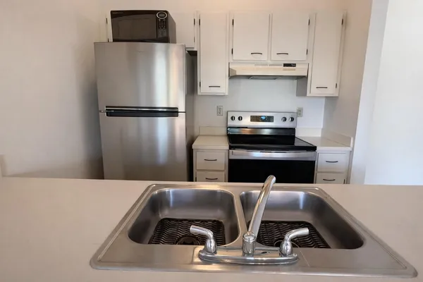 a kitchen with a appliances and cabinets