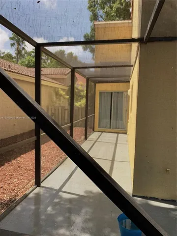 a kitchen with stainless steel appliances kitchen island granite countertop a refrigerator and stove