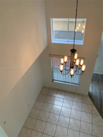 a kitchen with granite countertop a sink and a stove top oven