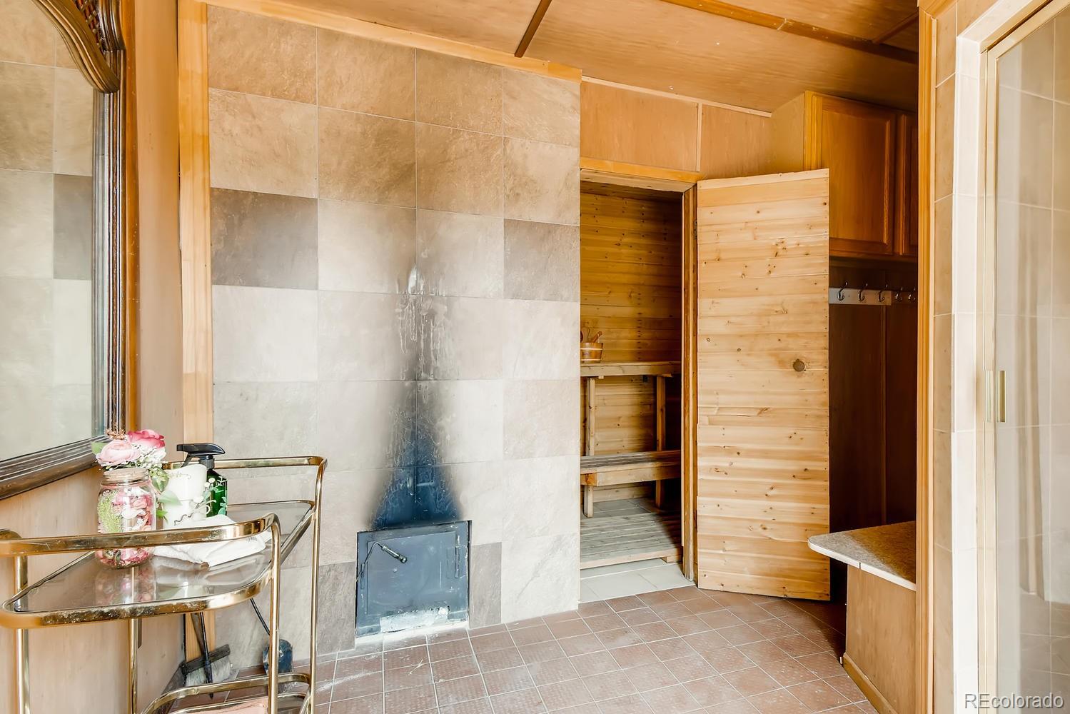 816 3rd Street Fort Lupton, CO 80621 - Photo 14 of 31 a bathroom with a glass door shower and a sink
