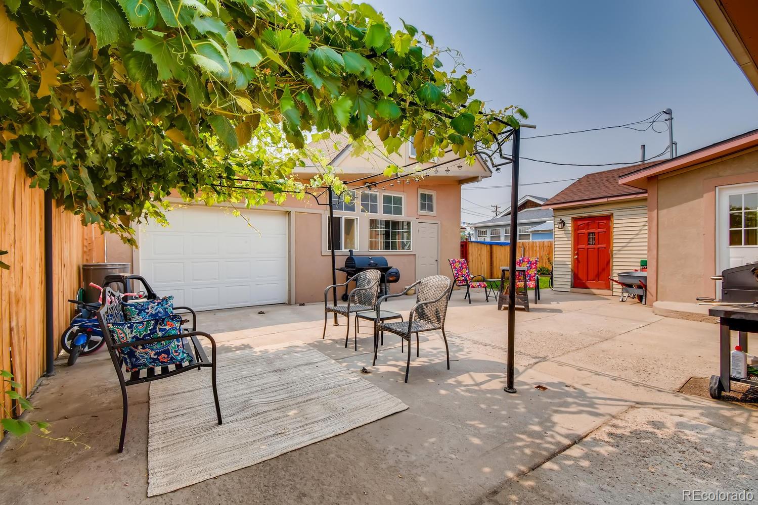 816 3rd Street Fort Lupton, CO 80621 - Photo 18 of 31 a view of a patio with table and chairs and potted plants