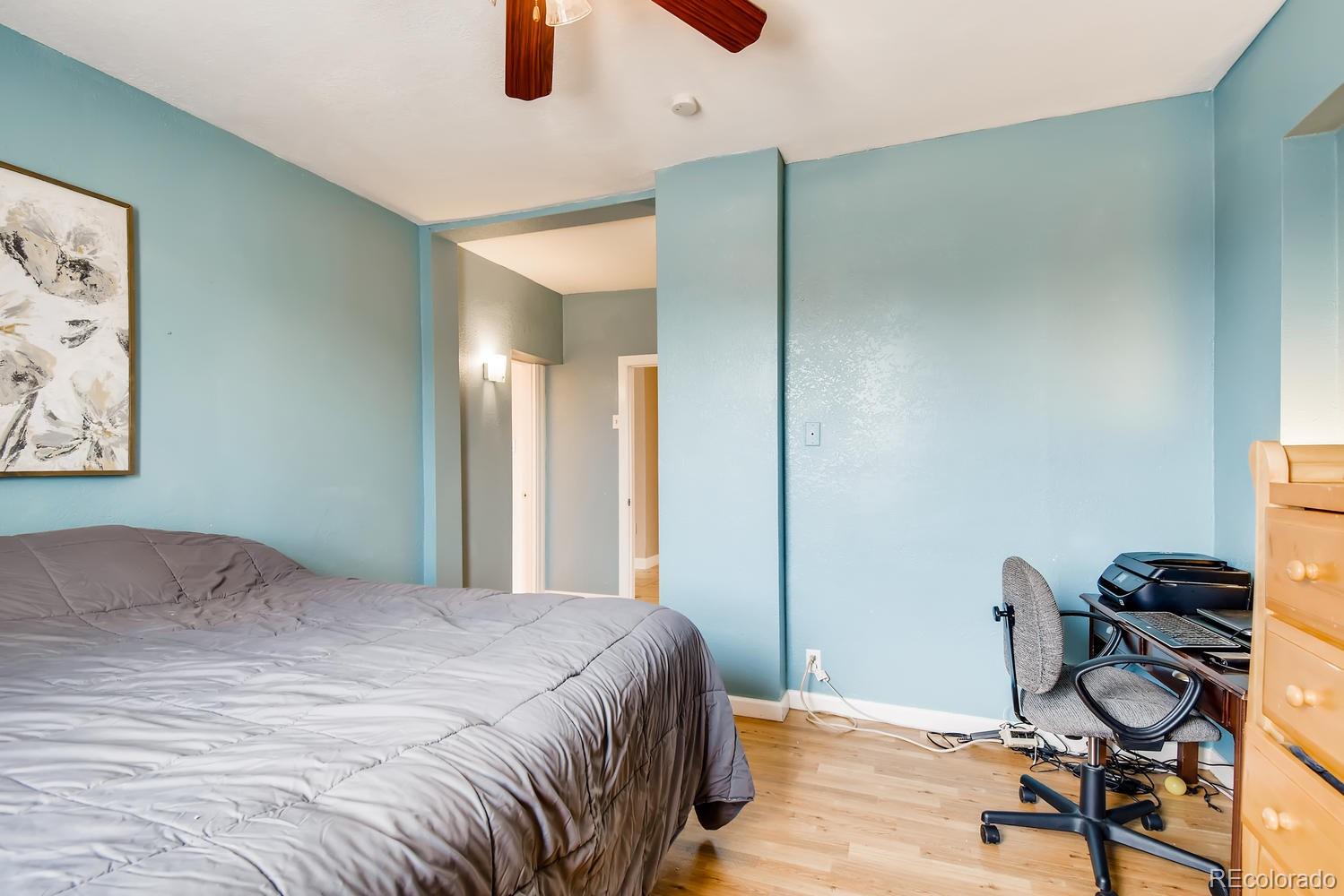 816 3rd Street Fort Lupton, CO 80621 - Photo 22 of 31 a bedroom with a bed and a desk