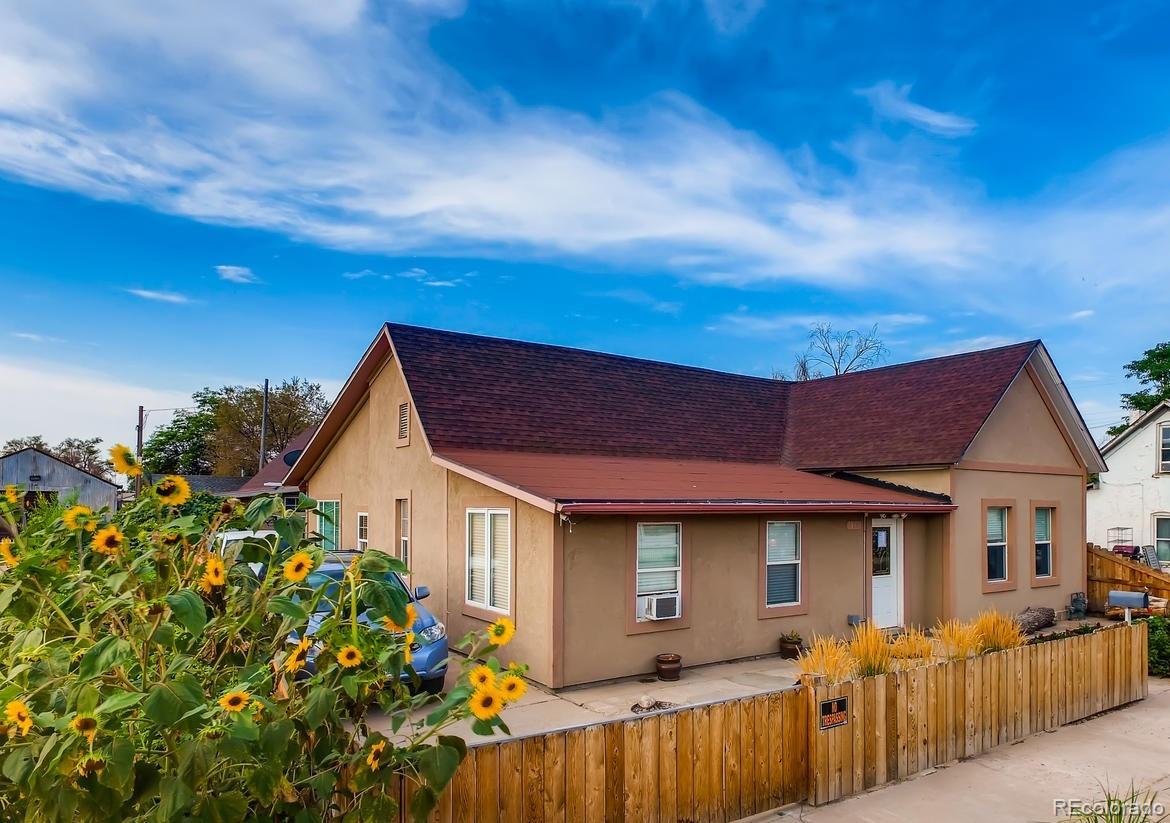 816 3rd Street Fort Lupton, CO 80621 - Photo 30 of 31 a view of a house with a patio