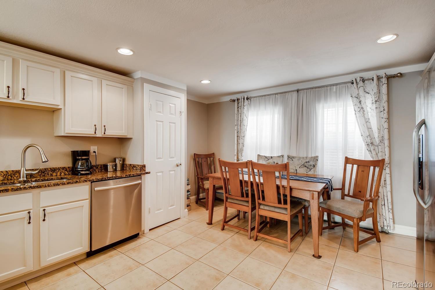 816 3rd Street Fort Lupton, CO 80621 - Photo 10 of 31 a view of kitchen with granite countertop cabinets table and chairs