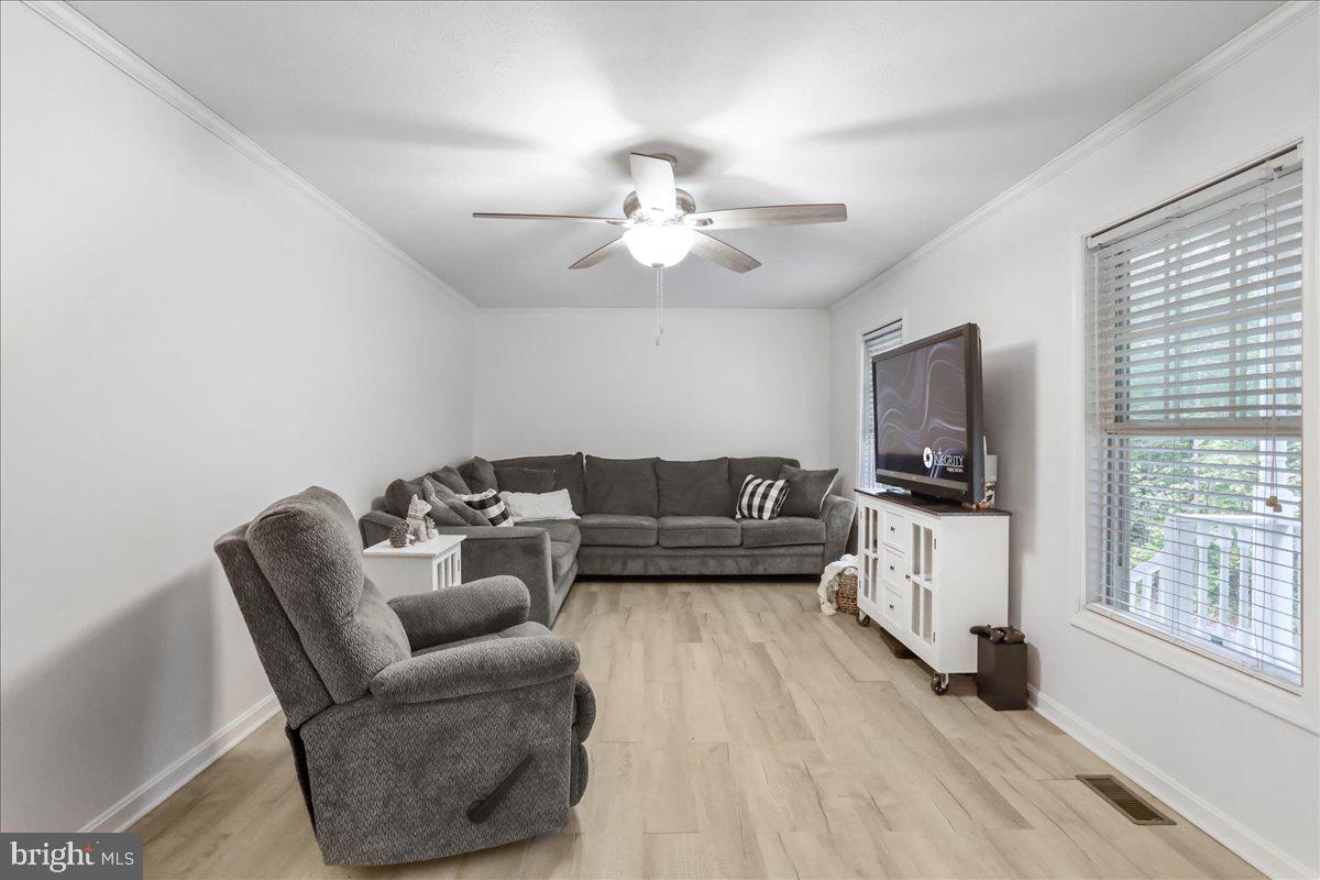 2726 Cave Ridge Road Mount Jackson, VA 22842 - Photo 13 of 39 a living room with furniture a flat screen tv and a window
