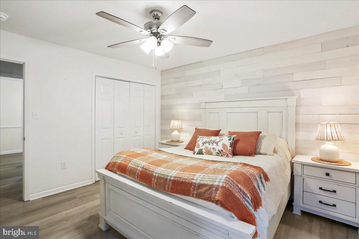 2726 Cave Ridge Road Mount Jackson, VA 22842 - Photo 21 of 39 a bedroom with a bed and a chandelier