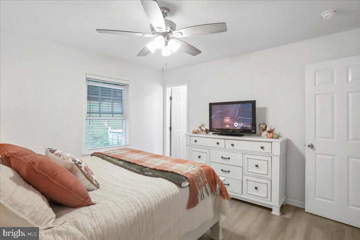 2726 Cave Ridge Road Mount Jackson, VA 22842 - Photo 22 of 39 a bedroom with a bed and a flat screen tv