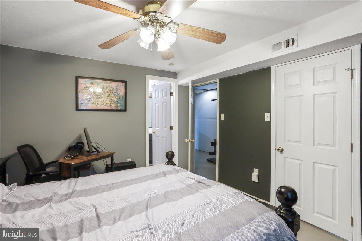 2726 Cave Ridge Road Mount Jackson, VA 22842 - Photo 26 of 39 a bedroom with a bed and a chandelier