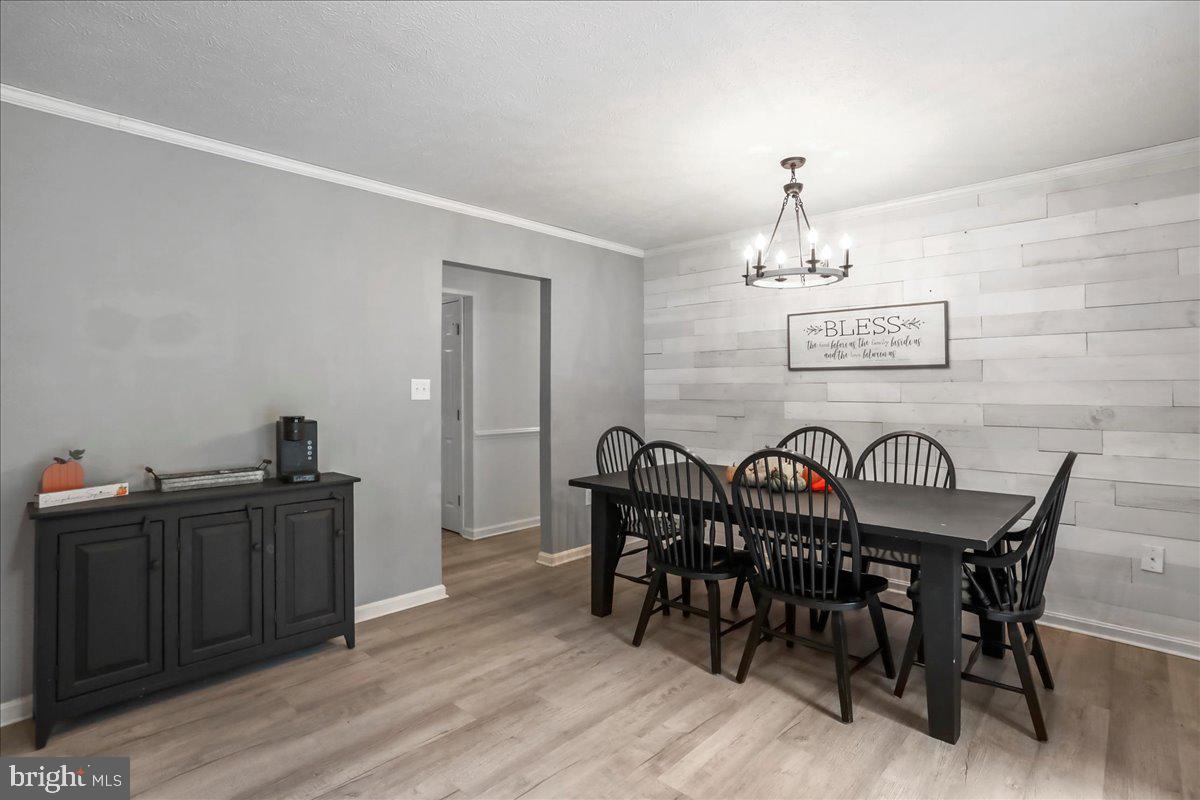2726 Cave Ridge Road Mount Jackson, VA 22842 - Photo 10 of 39 a view of a dining room with furniture and chandelier