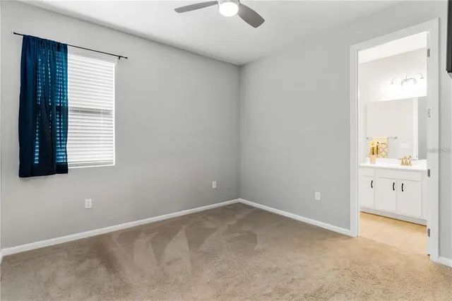 an empty room with windows and entrance