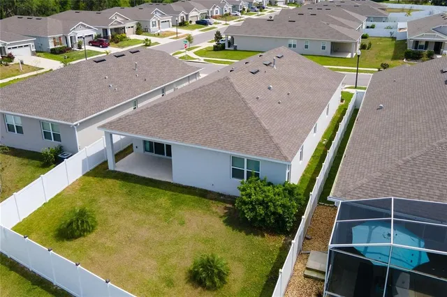 an aerial view of a house with a swimming pool