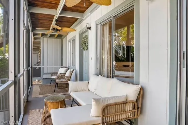 a outdoor space with patio couch and glass door