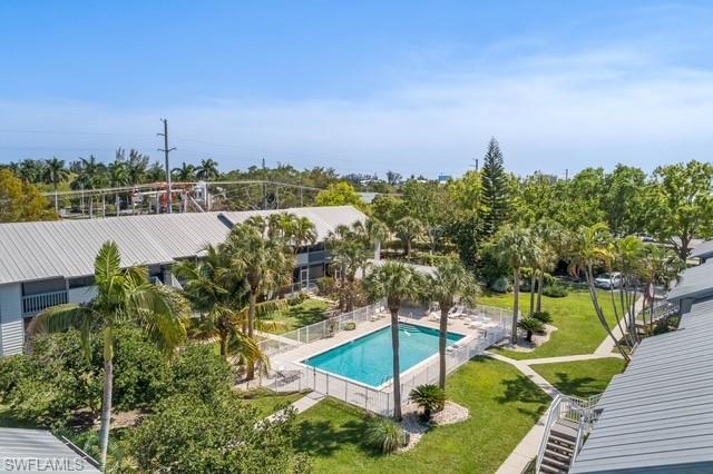 1251 7th Avenue North, Unit 307 Naples, FL 34102 - Photo 17 of 23 a view of a lake with a house in the background