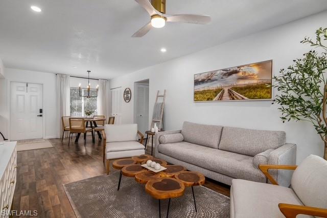 1251 7th Avenue North, Unit 307 Naples, FL 34102 - Photo 2 of 23 a living room with furniture and a large window