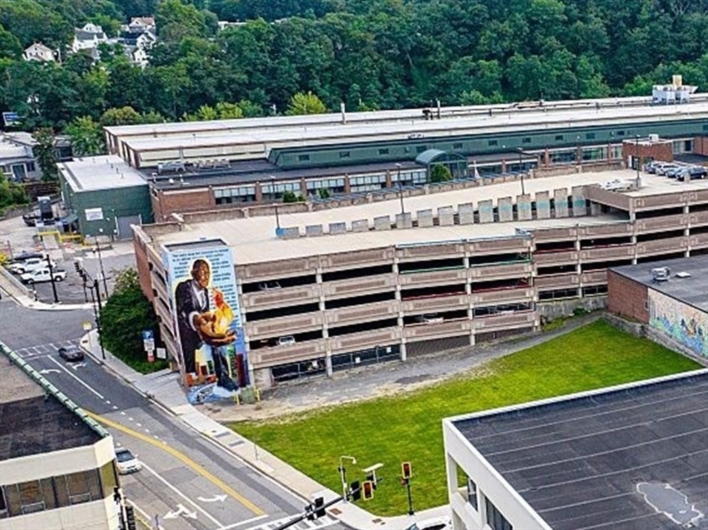 520 Main Street Fitchburg, MA 01420 - Photo 3 of 3 a view of a backyard with chairs and a table