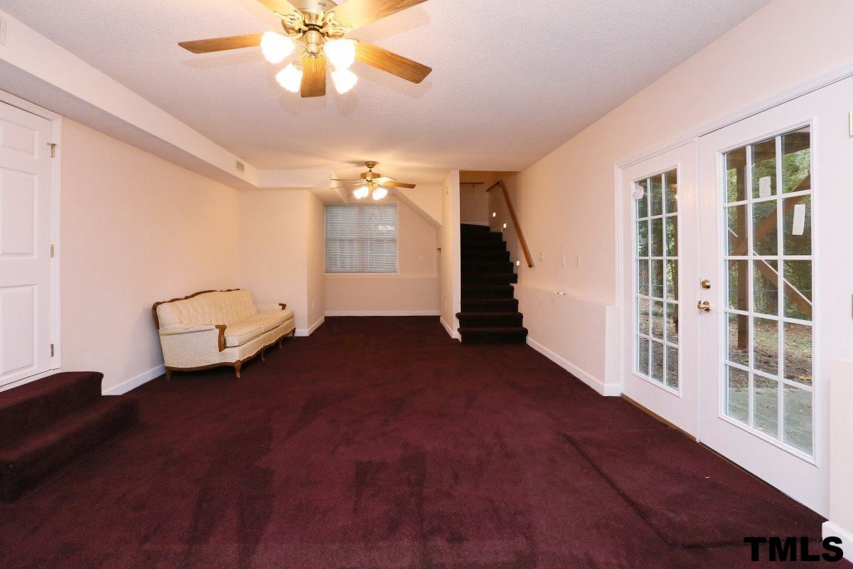 711 Edmund Street Raleigh, NC 27604 - Photo 14 of 25 a view of a livingroom with a ceiling fan and window