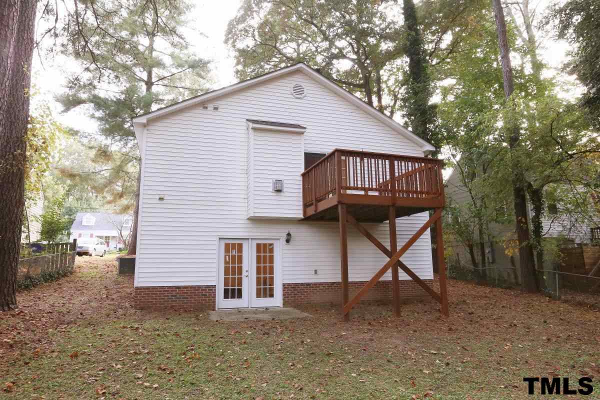 711 Edmund Street Raleigh, NC 27604 - Photo 22 of 25 a view of a house with a yard