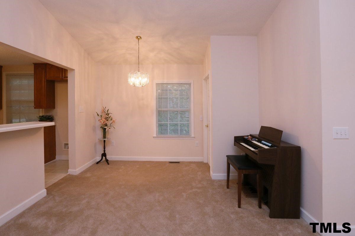711 Edmund Street Raleigh, NC 27604 - Photo 8 of 25 a room with a window and a potted plant