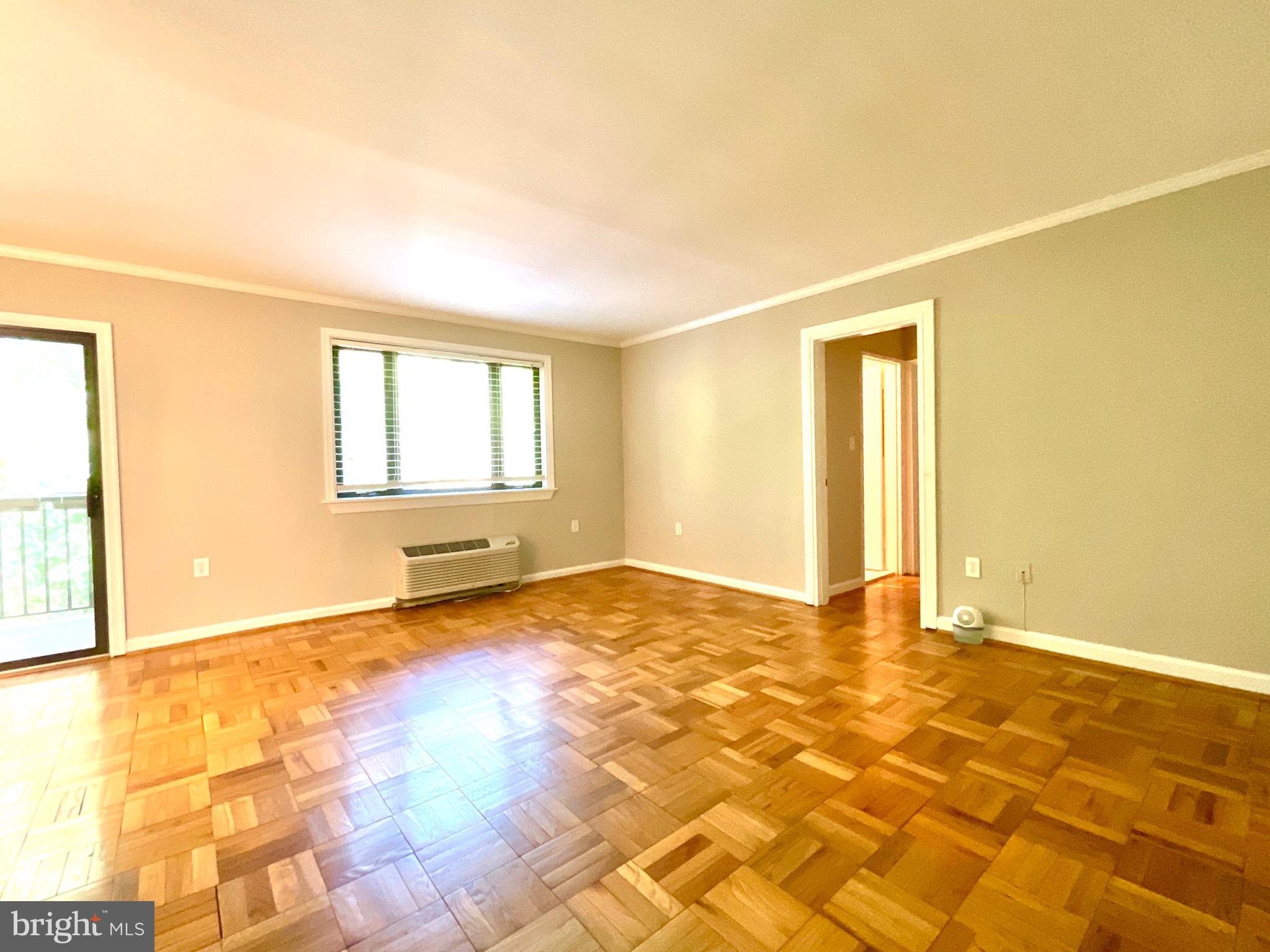 4114 Davis Place Northwest, Unit 210 Washington, DC 20007 - Photo 7 of 19 a view of an empty room with a window
