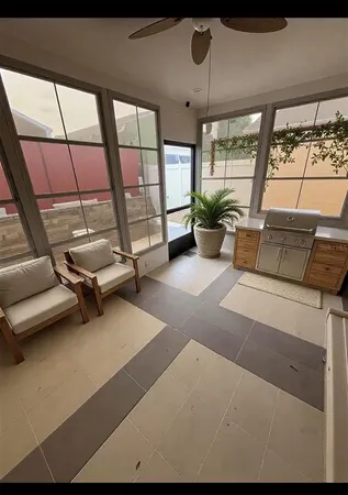 a living room with furniture a window and ceiling fan