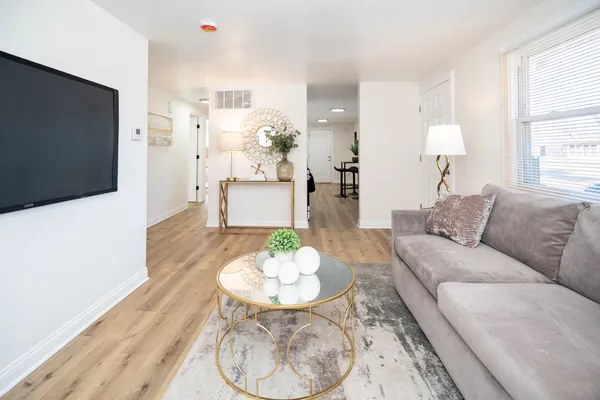 a living room with furniture and a flat screen tv