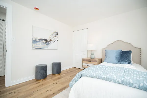 a bedroom with a bed and a table