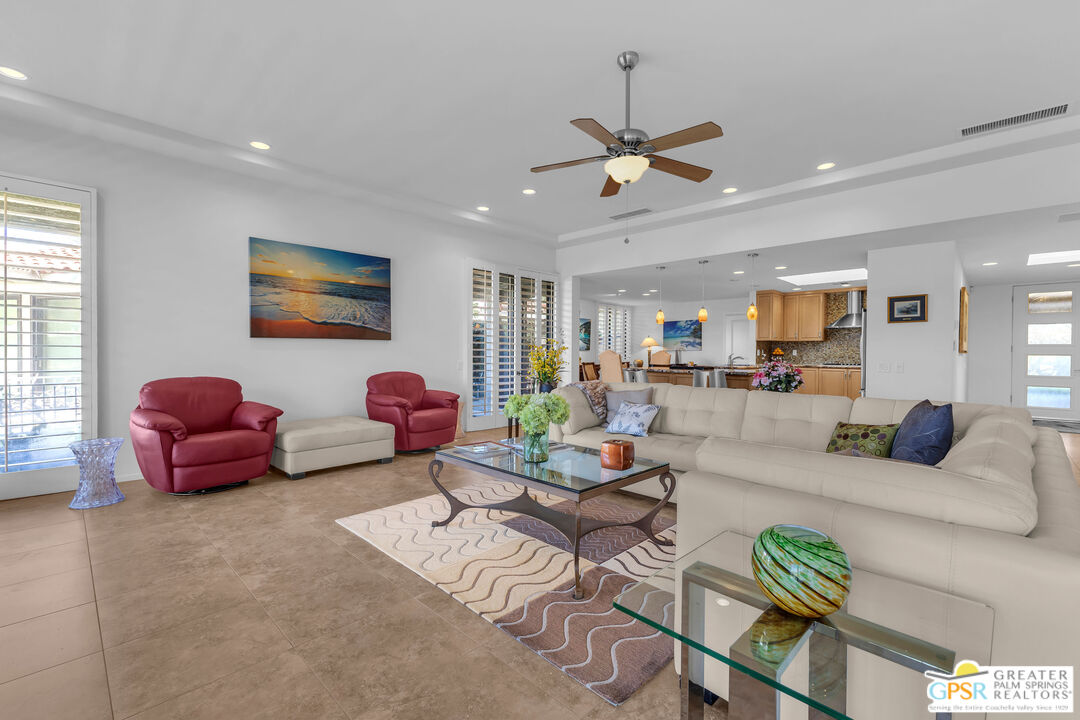 10 Colgate Drive Rancho Mirage, CA 92270 - Photo 14 of 45 a living room with furniture a window and a flat screen tv
