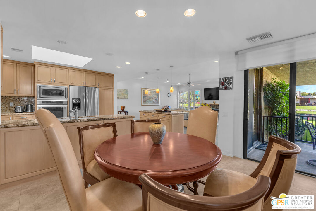10 Colgate Drive Rancho Mirage, CA 92270 - Photo 22 of 45 a dining room with furniture a window and kitchen view