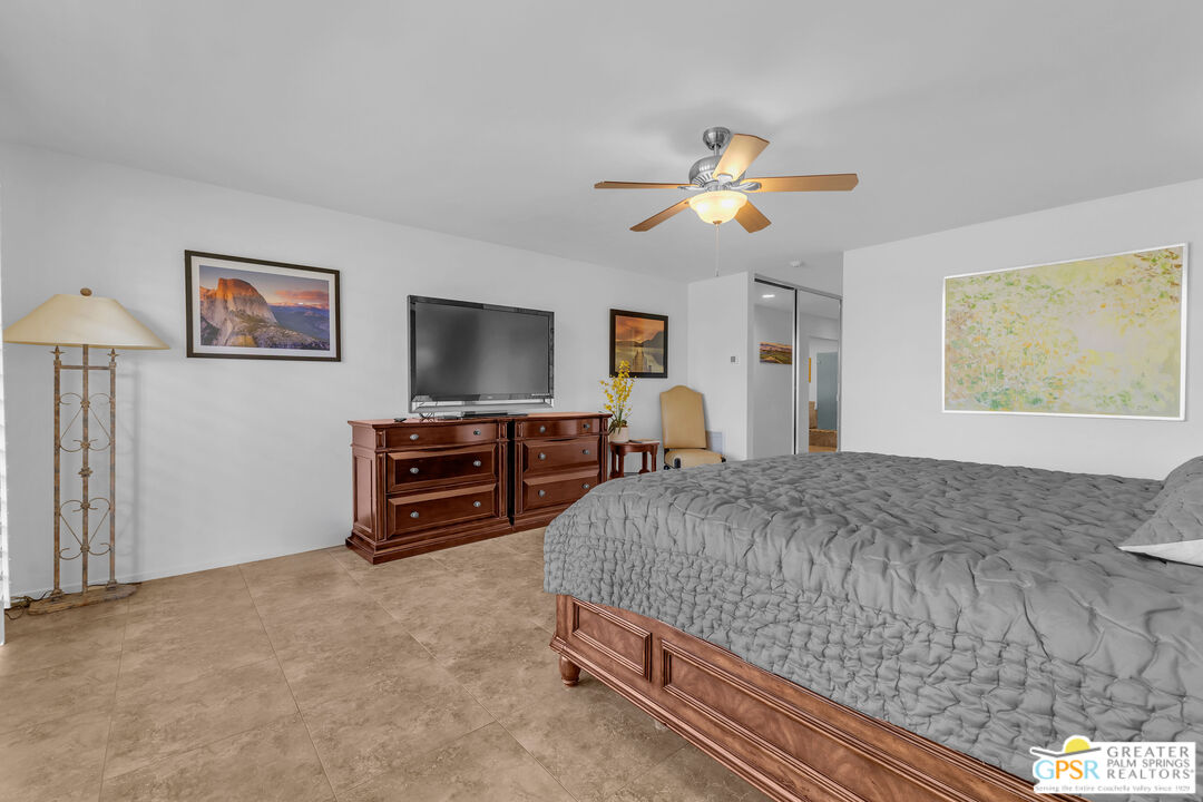 10 Colgate Drive Rancho Mirage, CA 92270 - Photo 27 of 45 a living room with furniture and a flat screen tv