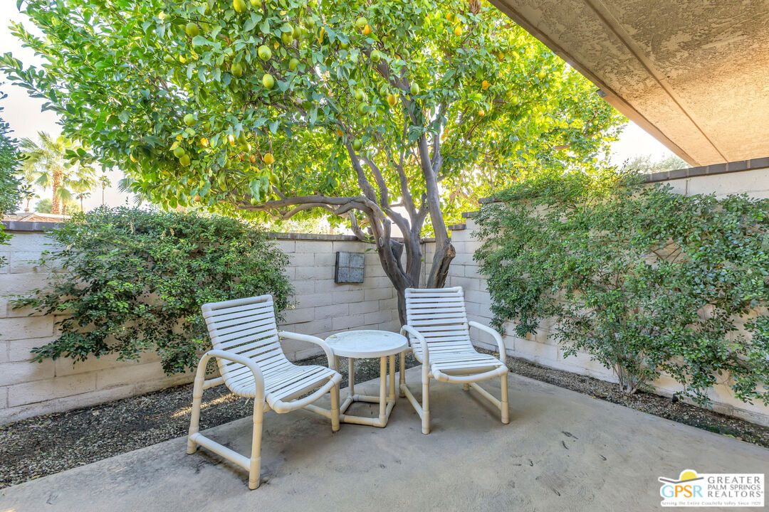 10 Colgate Drive Rancho Mirage, CA 92270 - Photo 36 of 45 a view of a chairs and table in the backyard