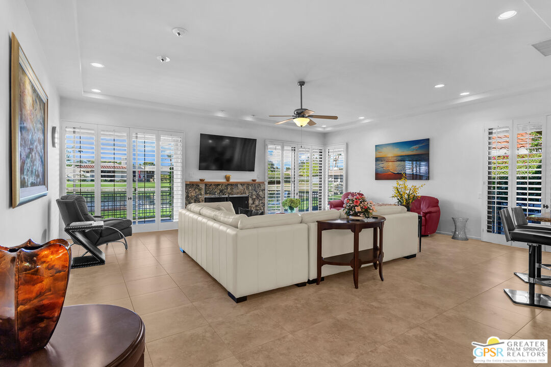 10 Colgate Drive Rancho Mirage, CA 92270 - Photo 5 of 45 a living room with furniture and a flat screen tv