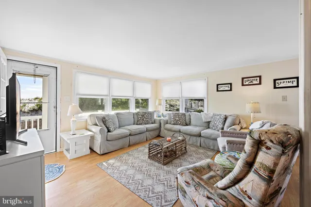 a open kitchen with a table chairs stove and cabinets