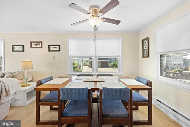 a bedroom with two beds and a window