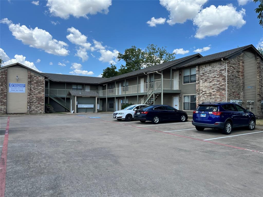 2526 West Prairie Street, Unit 203 Denton, TX 76201 - Photo 7 of 7 a view of a car in front of garage